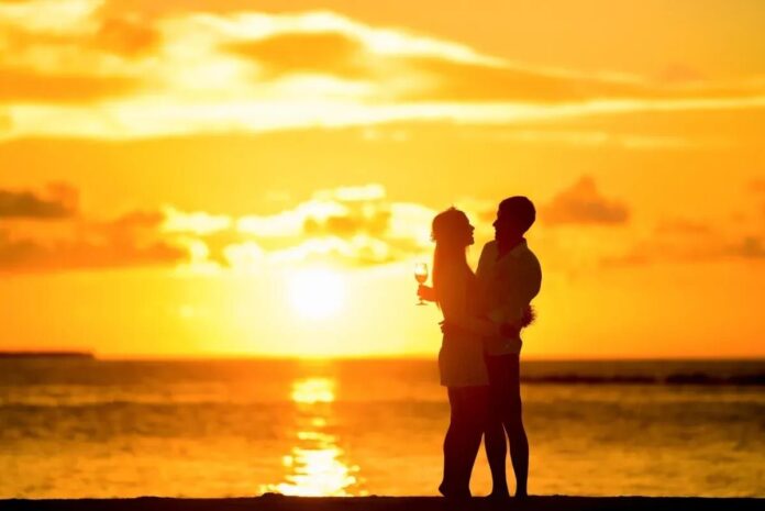 A Couple at a Beach Depicting Romantic Relationship